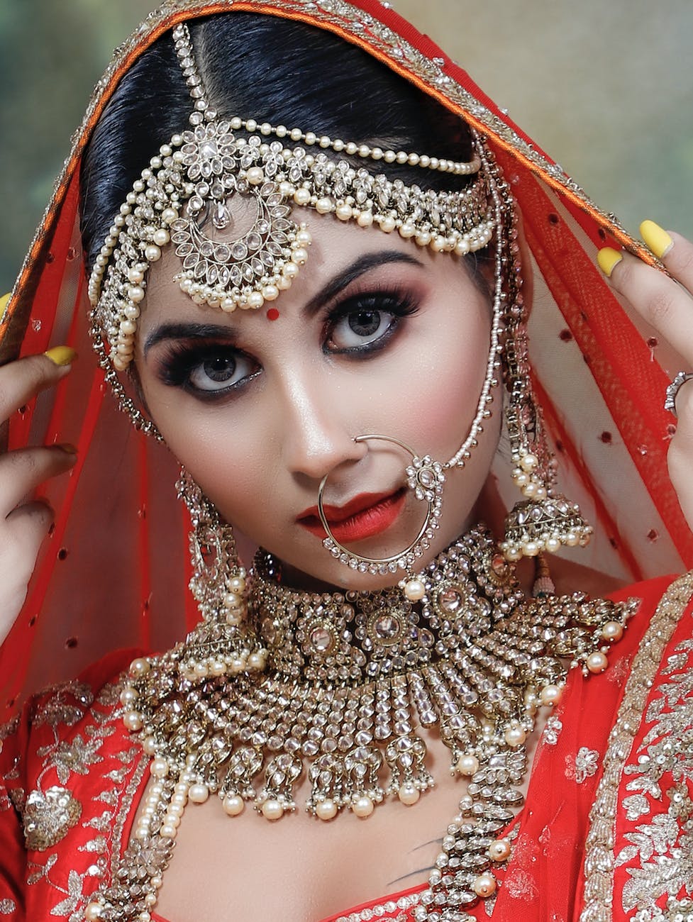 indian woman in traditional bridal clothes with jewelries and makeup